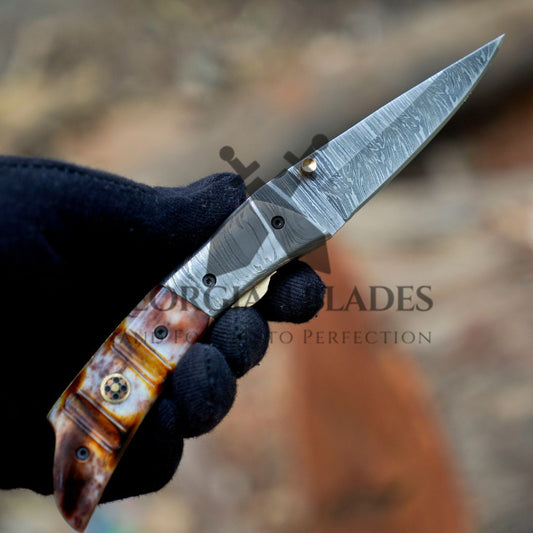 The Nimitz Folder ā 7.5 inch Damascus Steel Liner Lock Pocket Knife with Bone Handle and Leather Sheath