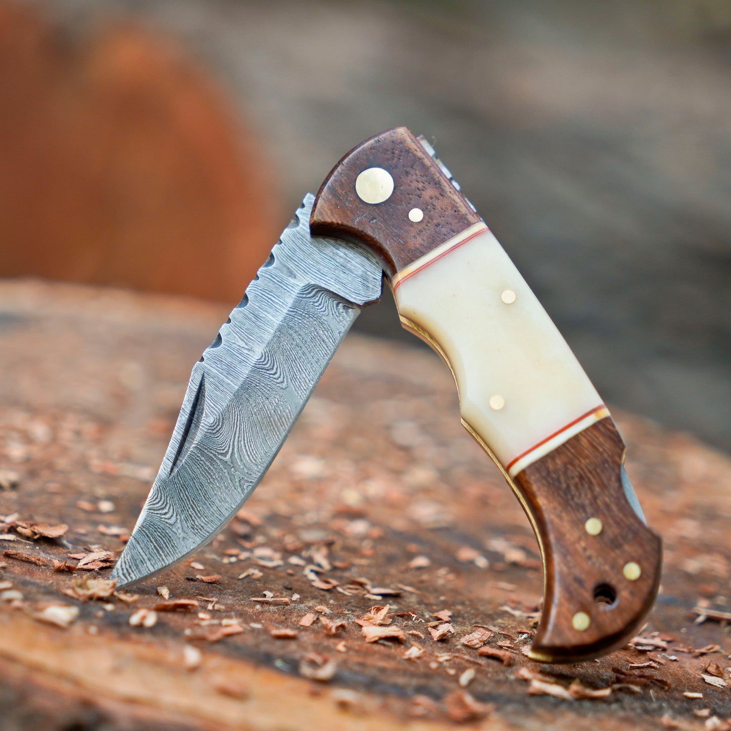 Horned Hunter: Custom Forged Damascus Steel Folding Knife Wood & Bone Handle