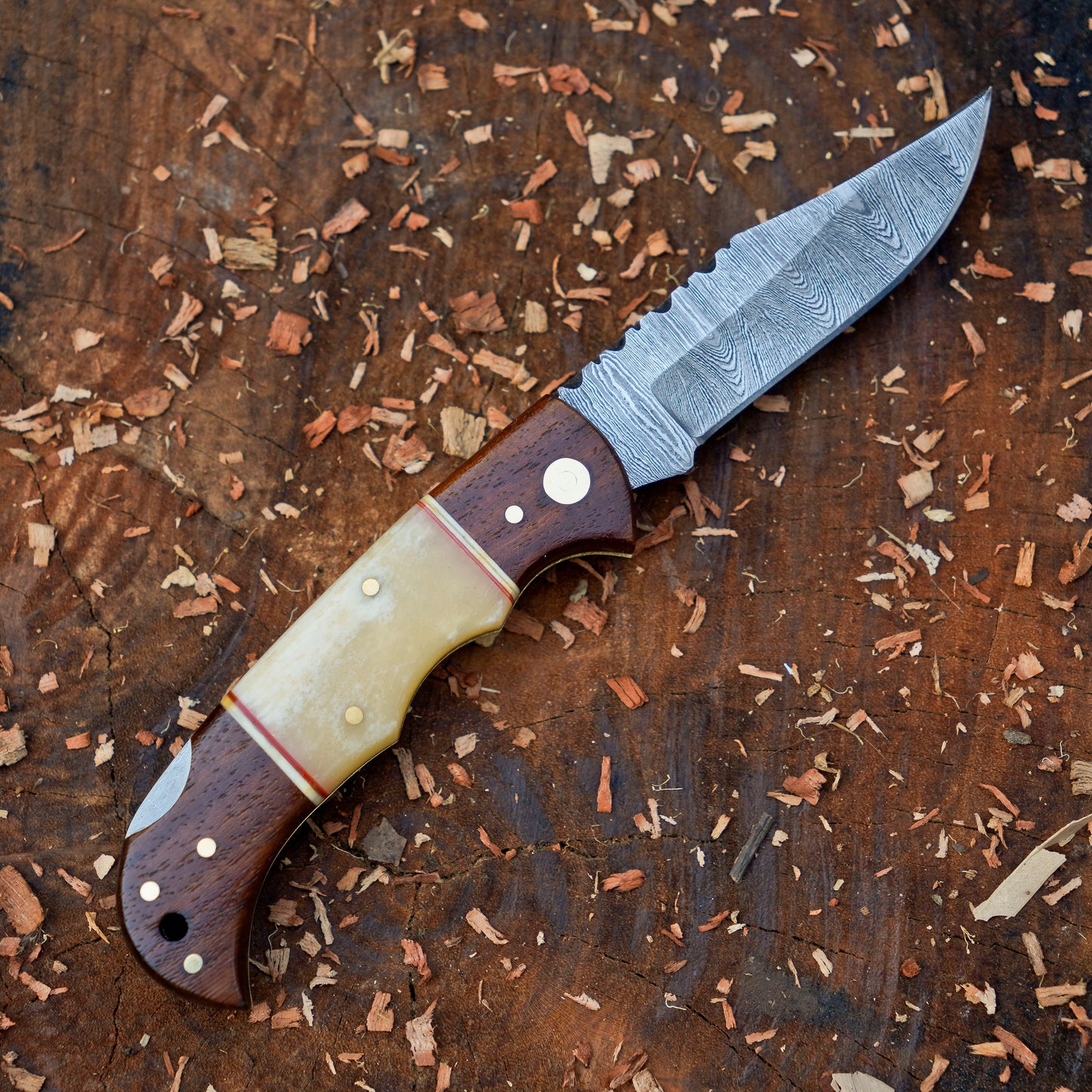 Horned Hunter: Custom Forged Damascus Steel Folding Knife Wood & Bone Handle