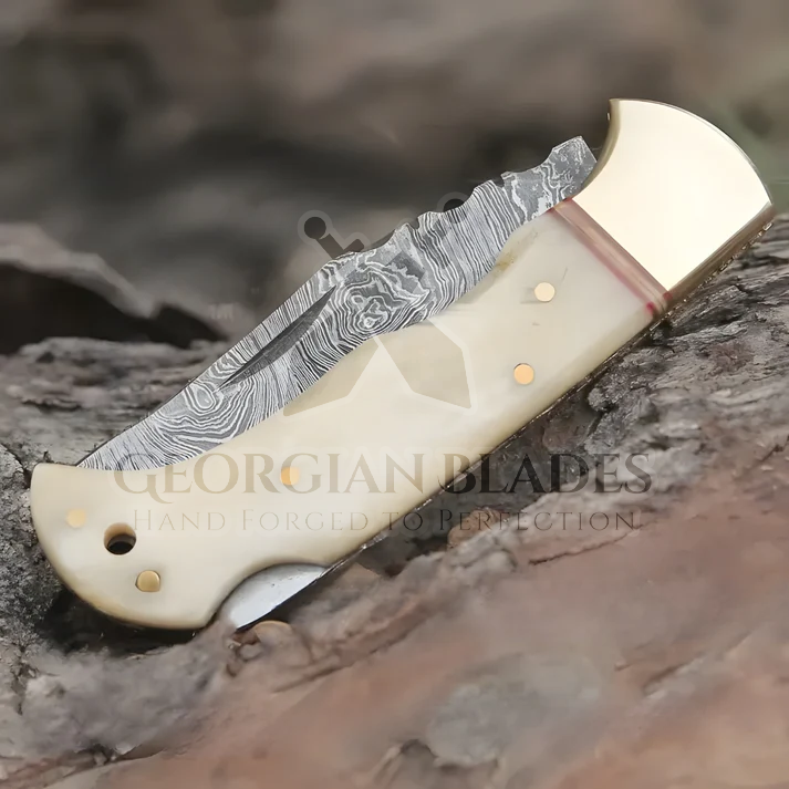 Skeletal Saber - Custom Hand Forged Damascus Folding Knife Engraved Brass Bolster With Bone Handle