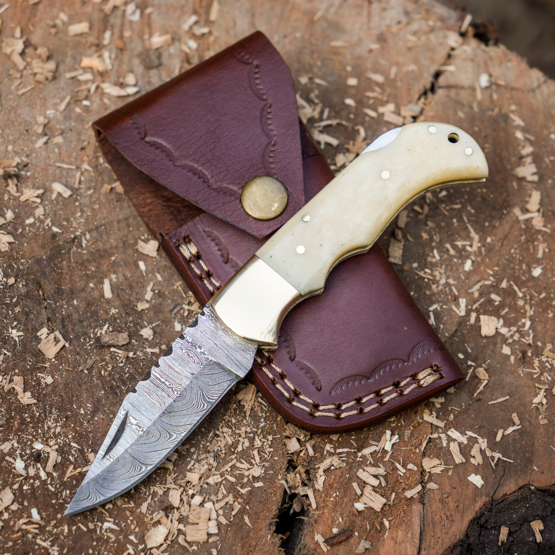 Skeletal Saber - Custom Hand Forged Damascus Folding Knife Engraved Brass Bolster With Bone Handle