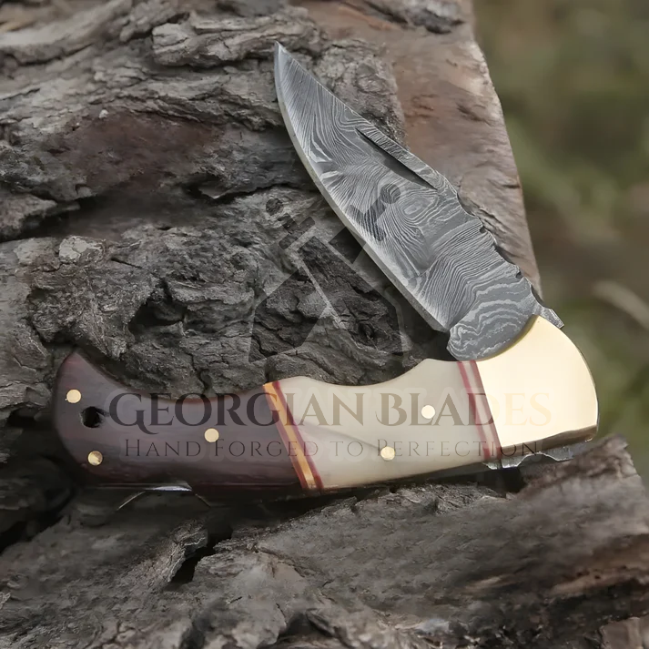 Horned Hero: Hand Forged Damascus Steel Folding Knife W/ Rose Wood & Bone Handle