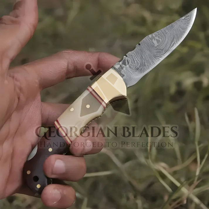 Horned Hero: Hand Forged Damascus Steel Folding Knife W/ Rose Wood & Bone Handle