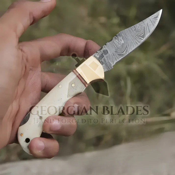 Skeletal Saber - Custom Hand Forged Damascus Folding Knife Engraved Brass Bolster With Bone Handle