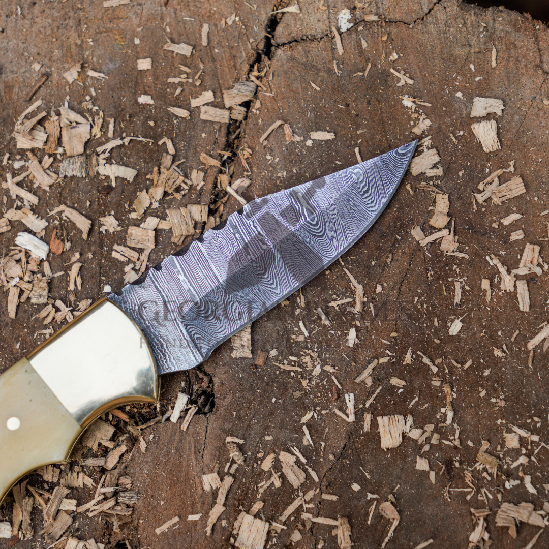 Skeletal Saber - Custom Hand Forged Damascus Folding Knife Engraved Brass Bolster With Bone Handle