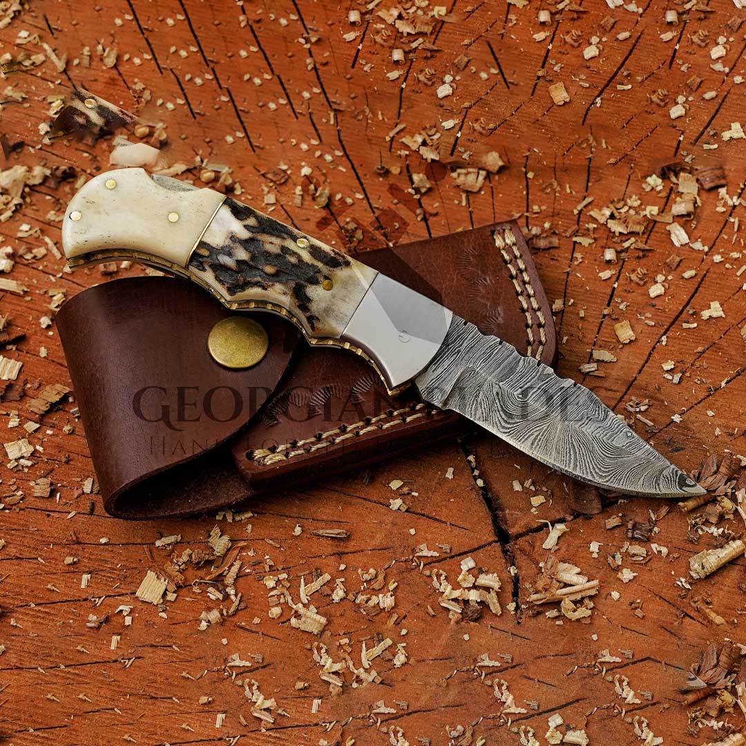 The "Boone's Edge" 6.75 inch Handmade Folding Knife Damascus Steel with Stag horn and Camel bone Handle with Leather Sheath